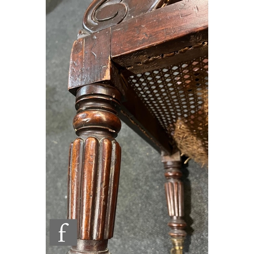 598 - A 19th Century mahogany bergere cane library chair in the manner of Gillows, the shaped bar back ove... 