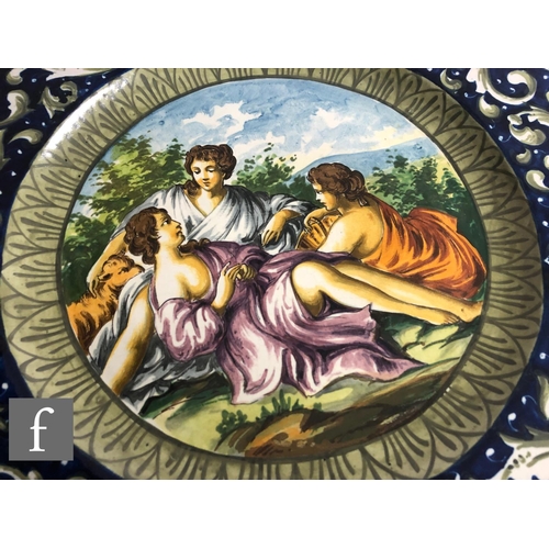 71 - A near pair of 19th Century Italian Faience Ware charger in the manner of Cantagalli, each decorated... 