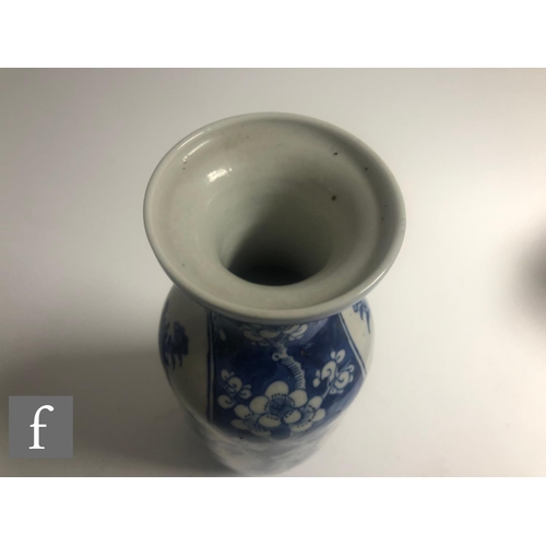 20 - A collection of Chinese late Qing Dynasty blue and white vases, to include a pair of sleeve vases an... 