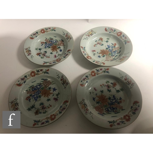 46 - A collection of eight Chinese 18th Century export porcelain dishes, painted in polychrome enamels, w... 