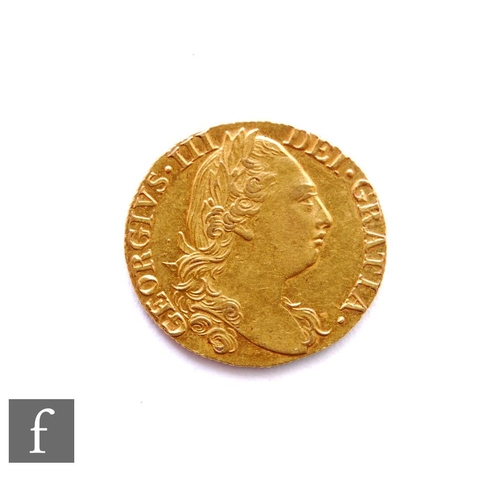 370 - George III (1760-1820) - A Guinea, 1779, fourth laureate head right, reverse crowned garnished shiel... 