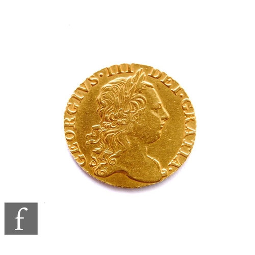 374 - George III (1760-1820) - A Guinea, 1773, third laureate head right, reverse crowned garnished shield... 