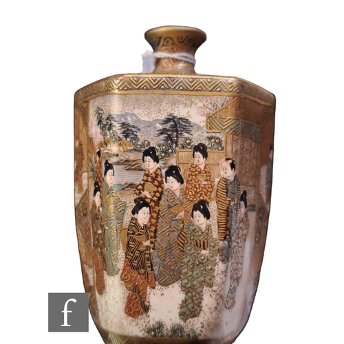 19 - A Japanese Satsuma vase of ovoid hexagonal from, rising from a splayed base, the heavily gilded body... 