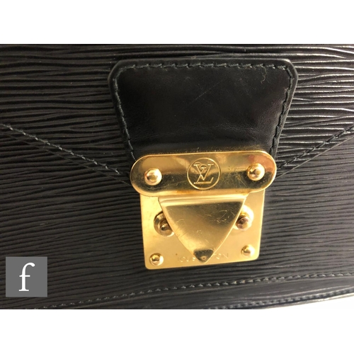 211 - A 1990s Louis Vuitton black Epi leather Monceau crossbody bag, with front pocket, embossed logo at f... 