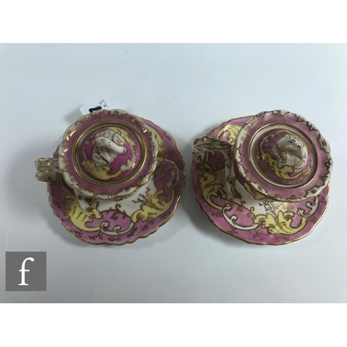 147 - A pair of 19th Century chamber sticks, each of waisted form with a domed cover and arched finial, mo... 