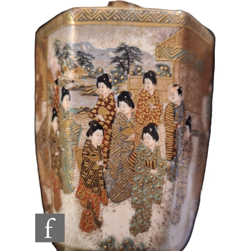 19 - A Japanese Satsuma vase of ovoid hexagonal from, rising from a splayed base, the heavily gilded body... 