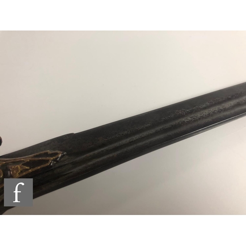 239 - A late 19th or early 20th Century Indian Tulwar sword, curved 76cm blade, the hilt decorated with ra... 