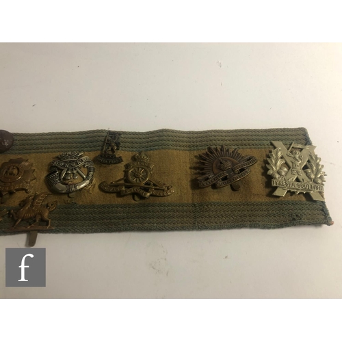 280 - A collection of mounted military badges and buttons, various regiments, Cheshire, Manchester, Bedfor... 