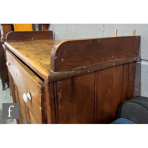 579 - A small Victorian stained pine dresser and rack, single drawer over a cupboard plinth base, height 1... 