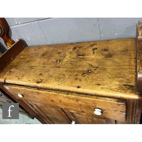 579 - A small Victorian stained pine dresser and rack, single drawer over a cupboard plinth base, height 1... 