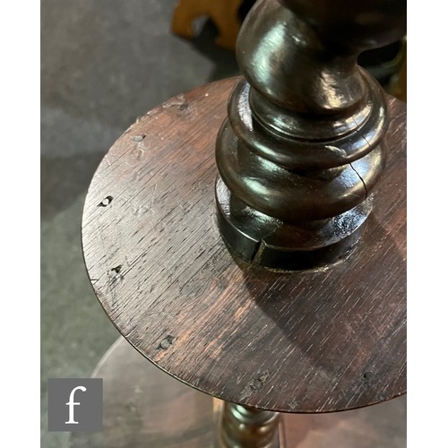 570 - A 19th Century circular rosewood lamp table or torchere stand, spiral twist column with small under-... 