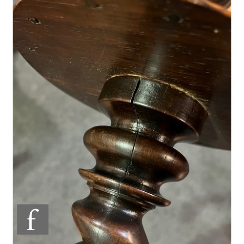 570 - A 19th Century circular rosewood lamp table or torchere stand, spiral twist column with small under-... 