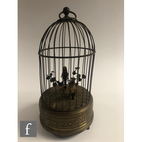 364 - An early 20th Century Griesbaum two singing birds in a brass cage, both birds move and sing, height ... 