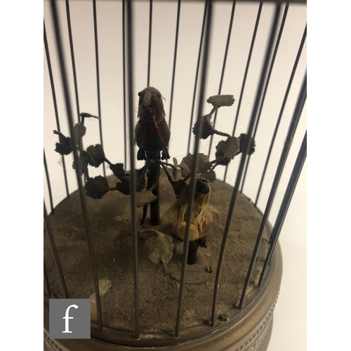 364 - An early 20th Century Griesbaum two singing birds in a brass cage, both birds move and sing, height ... 