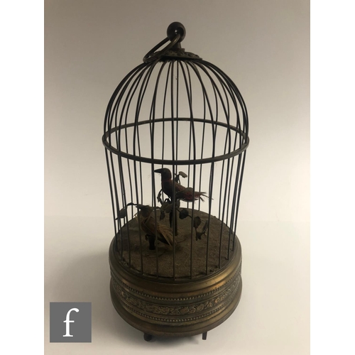 364 - An early 20th Century Griesbaum two singing birds in a brass cage, both birds move and sing, height ... 