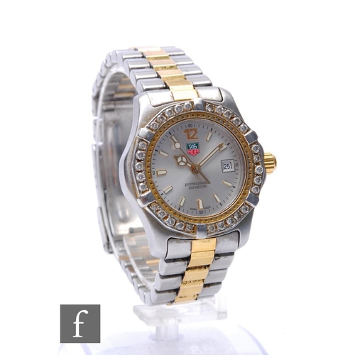 178 - A lady's gold and stainless steel Tag Heuer quartz wrist watch ref WK 1320with batons and date facil... 