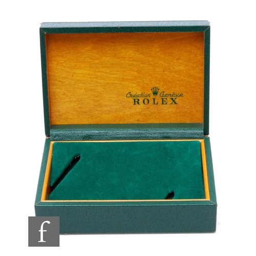 237 - A Rolex box in green leather with two watch boards inside, length 14.5cm, damaged.