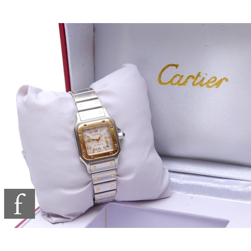 243 - A lady's stainless steel Cartier Santos wrist watch, Ref 2423. Roman numerals and date facility to a... 