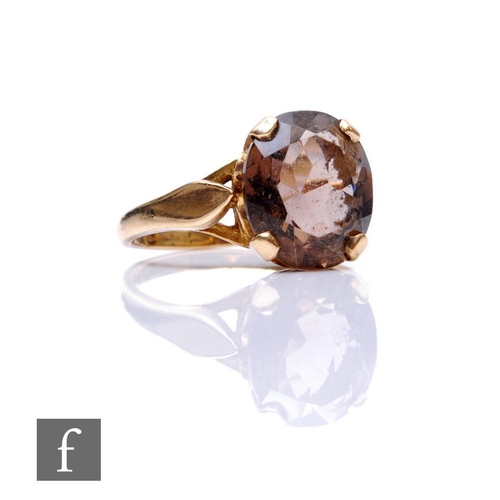 267 - A 9ct hallmarked smoky quartz single stone ring, claw set oval stone, weight 3.3g, ring size O.