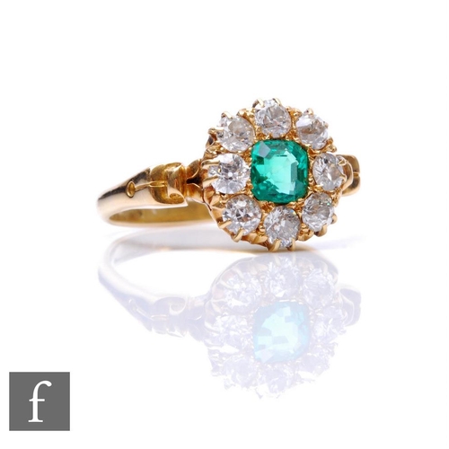 273 - An 18ct emerald and diamond cluster ring, central square cut emerald within a border of eight old cu... 