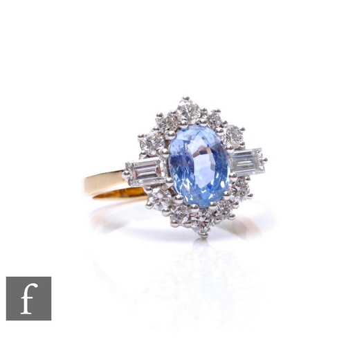 279 - An 18ct sapphire and diamond cluster ring, central oval claw set sapphire flanked by twin baguette d... 