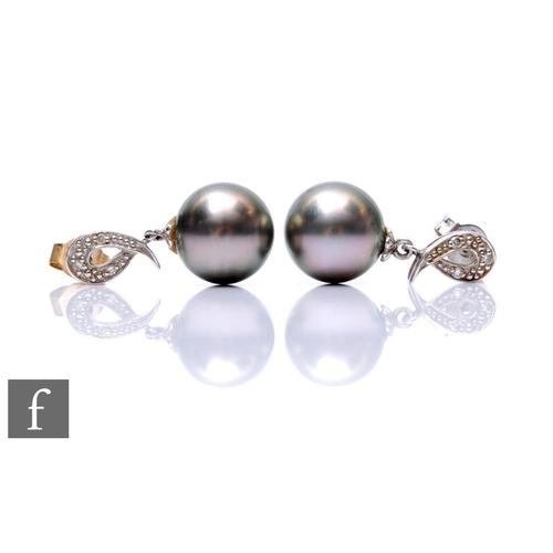 291 - A pair of 9ct hallmarked white gold black cultured pearl and diamond drop earrings, diameter of pear... 