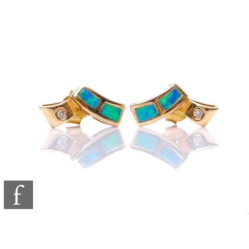 292 - A pair of 14ct opal and diamond stud earrings each with two opal panels and a single diamond, weight... 