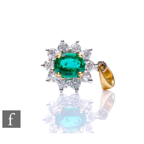 306 - An 18ct emerald and diamond cluster pendant, central emerald within a border of ten brilliant cut di... 