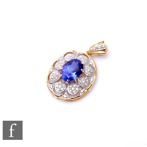 488 - A 18ct hallmarked oval tanzanite and diamond pendant, central claw set tanzanite to a pave set diamo... 