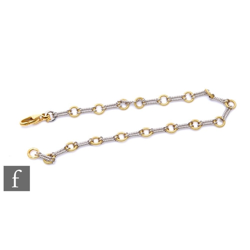 493 - An 18ct hallmarked yellow and white gold ring and bar link bracelet, weight 7.5g, length 19.5cm, ter... 