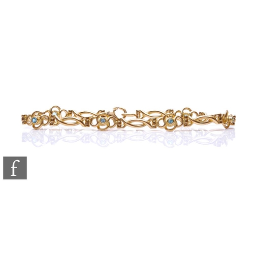 495 - A 9ct hallmarked fancy link bracelet highlighted with six individual set blue topaz, weight 8.8g, le... 