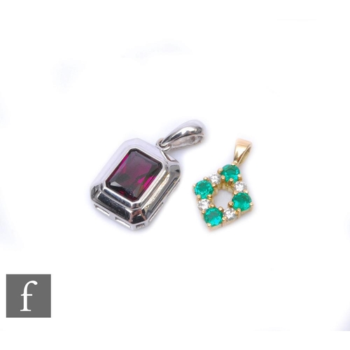 496 - Two 18ct stones set pendants, an emerald and diamond four stone example and a single stone amethyst ... 