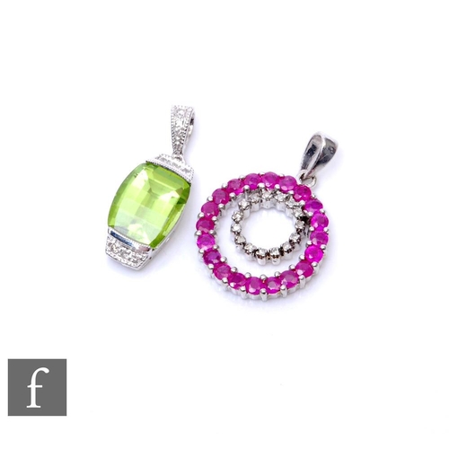 497 - Two 9ct hallmarked stone set pendants, a circular ruby and diamond example and a peridot and diamond... 