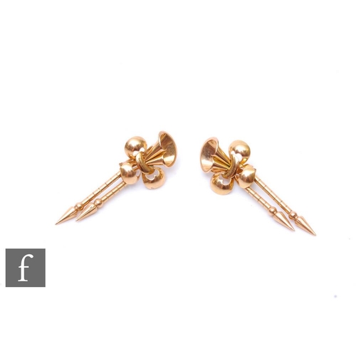 503 - A pair of 18ct drop earrings with a stylised fleur de lys design above twin drops, weight 9.5g, leng... 