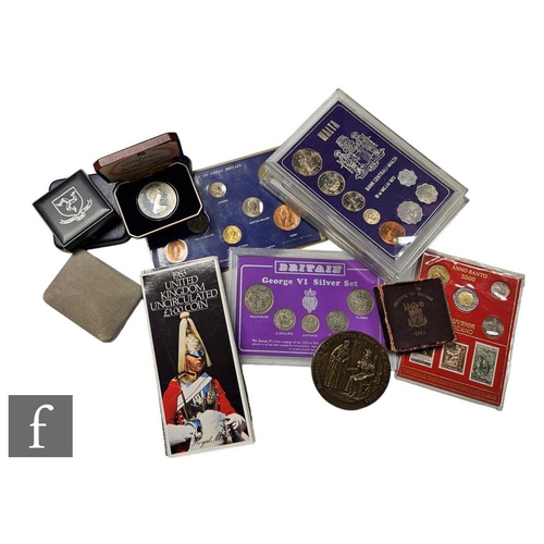 583 - An Elizabeth II 1974 Isle of Man Churchill Centenary crown, other cased sets and single coin sets in... 