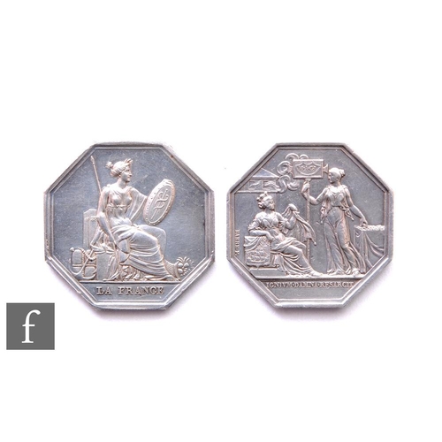 705 - A 19th Century French octagonal fire brigade award medal of two classically dressed figures near a b... 