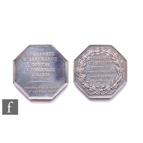 705 - A 19th Century French octagonal fire brigade award medal of two classically dressed figures near a b... 