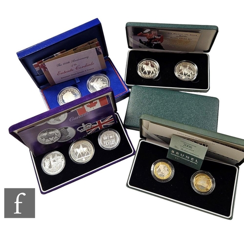 716 - Two Elizabeth II Royal Mint Millennium 2000 silver proof commemorative crowns, a 2002 Silver Jubilee... 