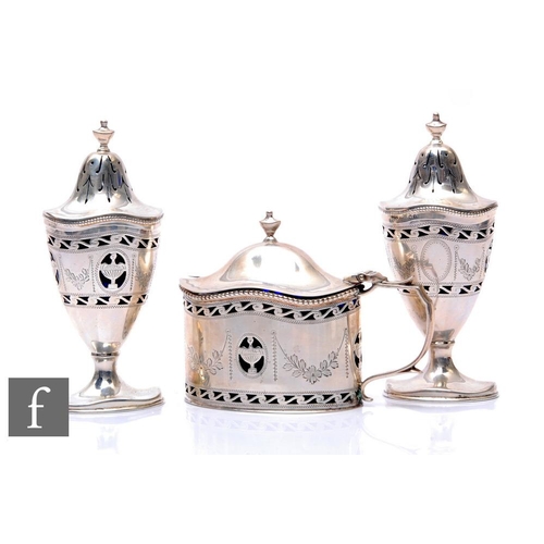 88 - A Queen Anne style hallmarked silver three piece cruet set with pierced and engraved swag decoration... 