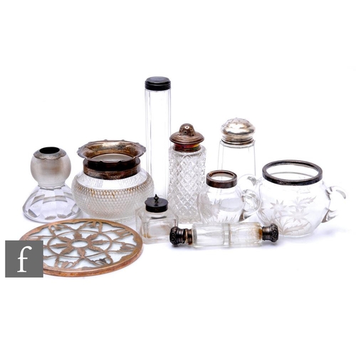 93 - Ten hallmarked silver and clear cut glass items to include a double ended scent bottle, a teapot sta... 