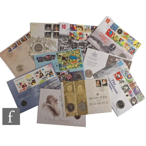 840 - An album of first day cover coins to include a Charles Darwin fifty pence, Olympic Games 2012 five p... 