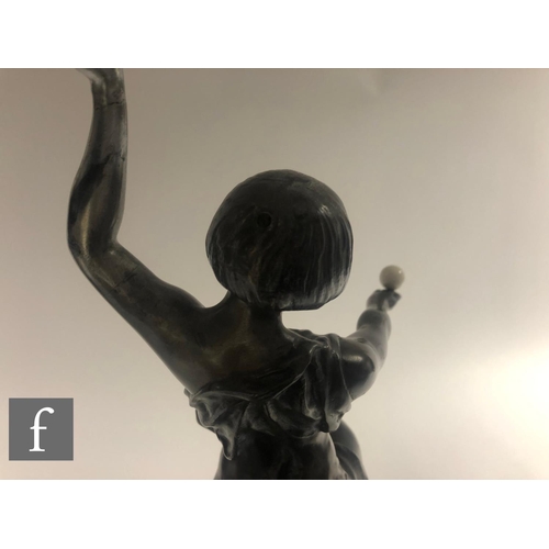 205 - AMENDED DESCRIPTION  A large 1920s patinated metal alloy figure of a female dancer standing on one l... 