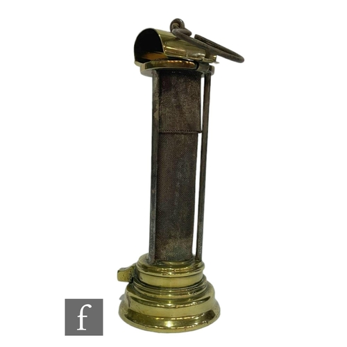 210 - An early 19th Century brass Davy miner's lamp with flip up top and pillar sides, No 47, height 24cm.