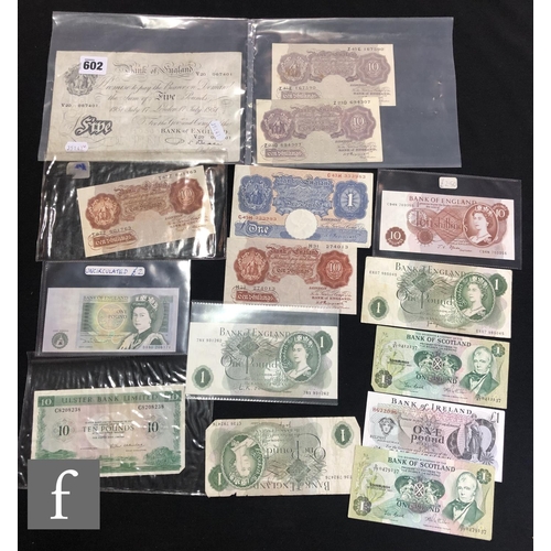 602 - A Bank of England 1951 five pound note, V20 067401, ten pound notes, a large collection of Britannia... 