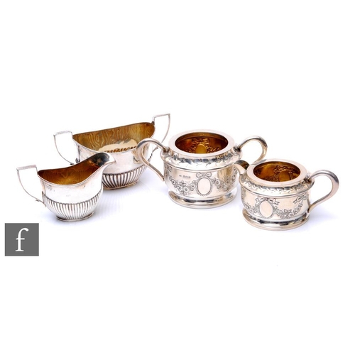 192 - A collection of silver hallmarked teawares, to include a George V fluted milk jug and sugar bowl, Lo... 