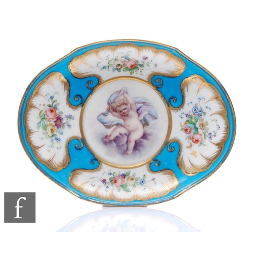 186 - An early 20th Century oval dish in the manner of Sevres, decorated with a hand painted cherub holdin... 