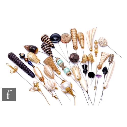 229 - A collection of various hat pins to include sequin, gilt metal and faux pearl examples. (43)