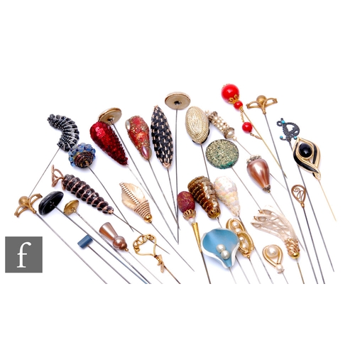 230 - A collection of various hat pins to include faux pearl, beadwork and sequin examples. (40)