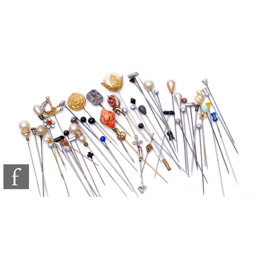 232 - A collection of various hatpins to include gilt metal, enamelled, faux pearl and beadwork examples. ... 