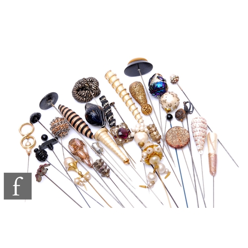 233 - A collection of various hatpins to include faux pearl, beadwork and sequin examples. (54)